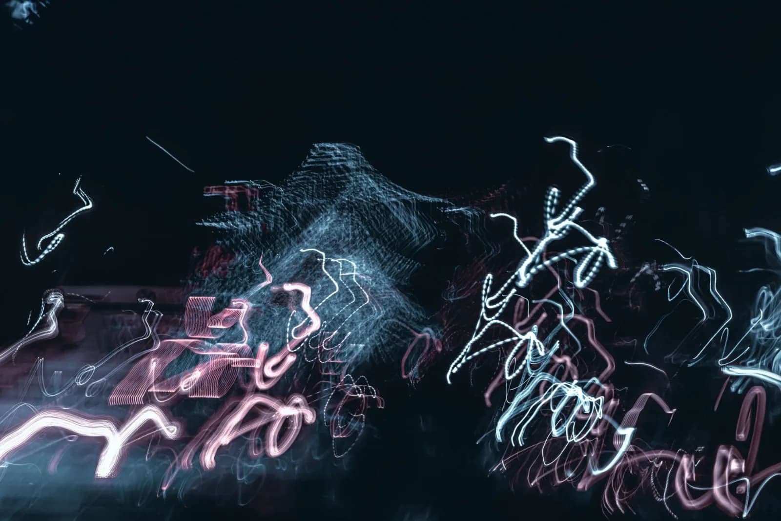 Vibrant abstract light trails create a dynamic and captivating visual at night.
