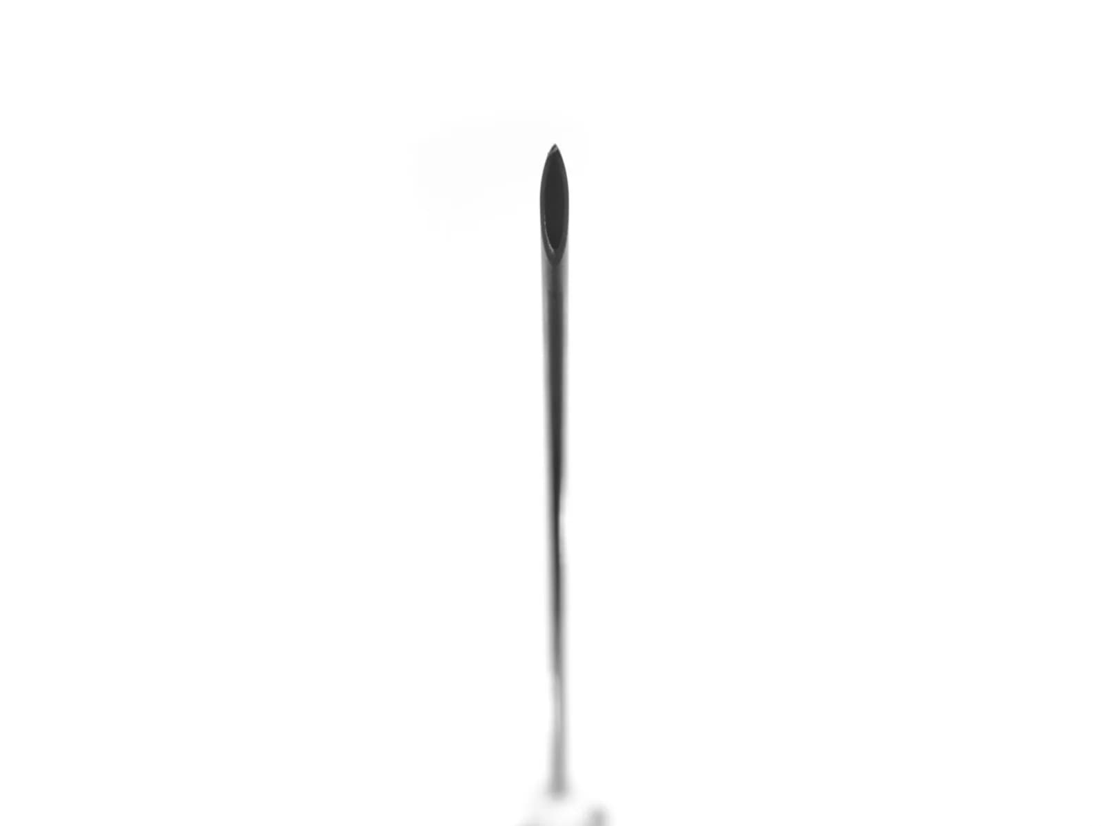 Close-up of a hypodermic needle's sharp point against a white background.