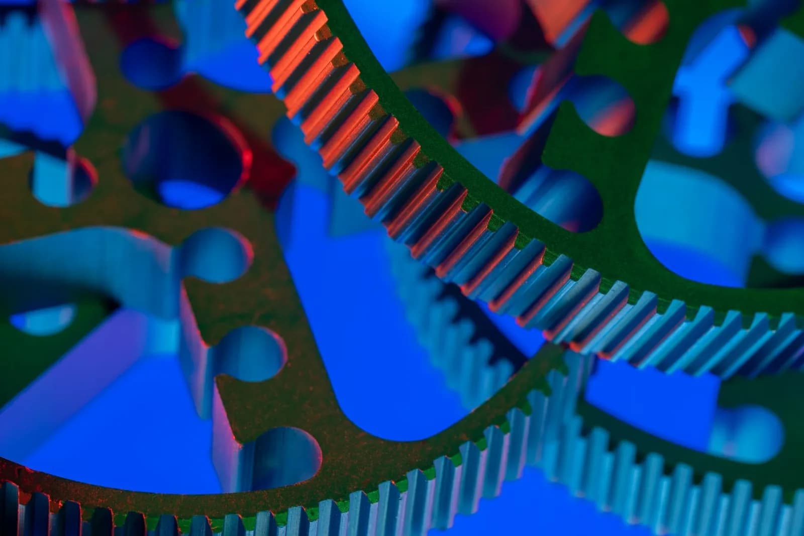 Vibrant close-up view of interlocking industrial gears, showcasing precision engineering.