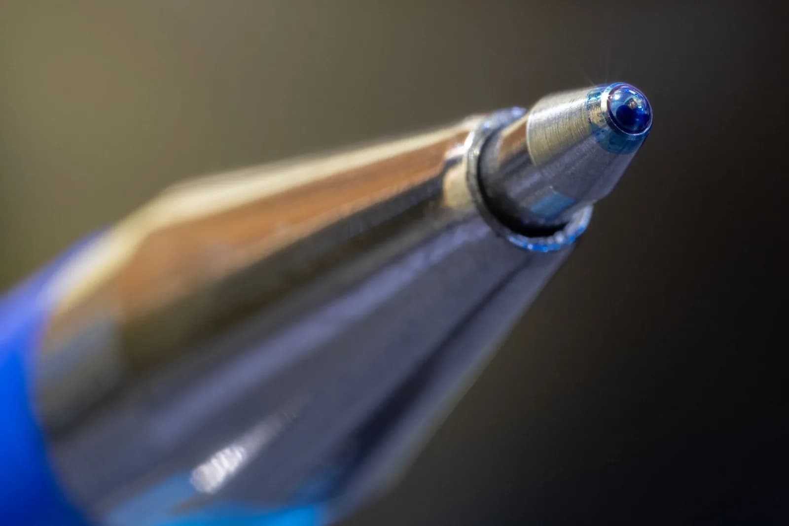 Macro shot highlighting the precision and design of a ballpoint pen tip.