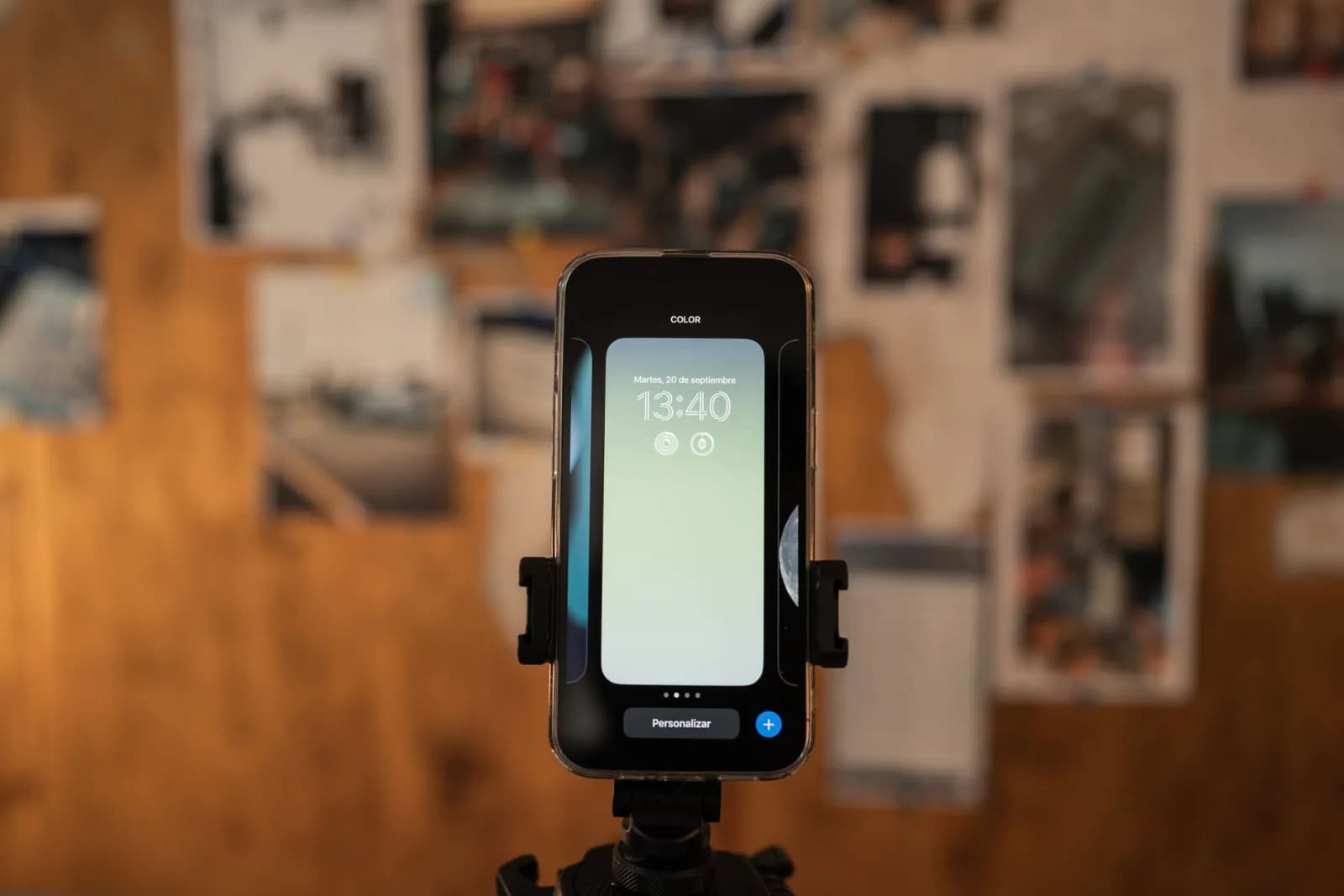 Close-up of a smartphone displaying time, captured indoors with a blurred background.