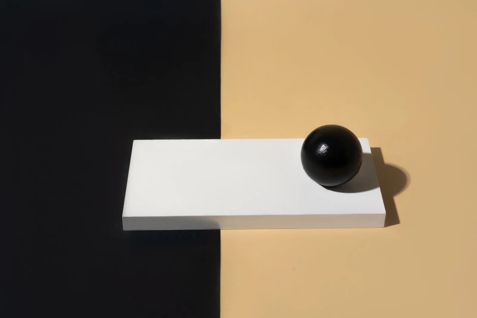 Artistic minimalist composition featuring geometric shapes and strong contrasts.