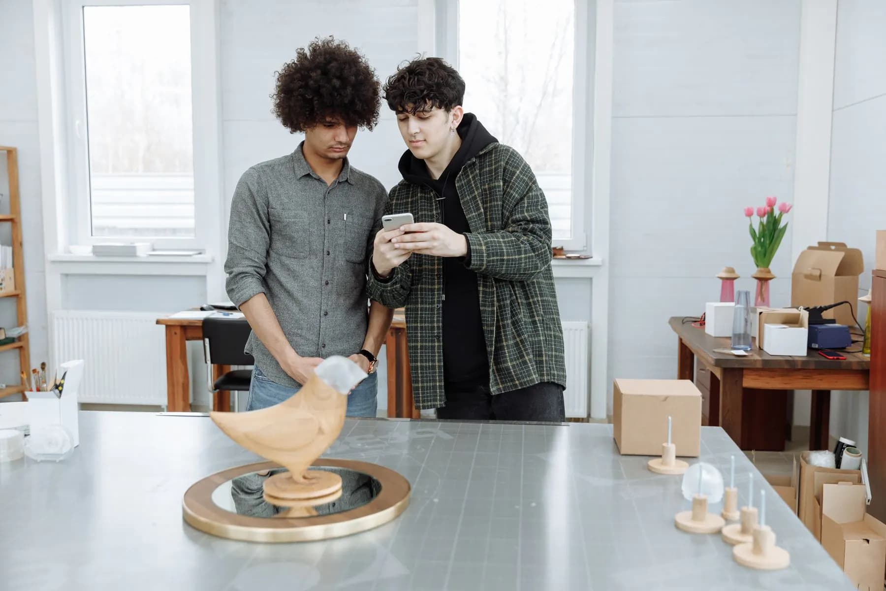Two designers reviewing an early product prototype in their studio