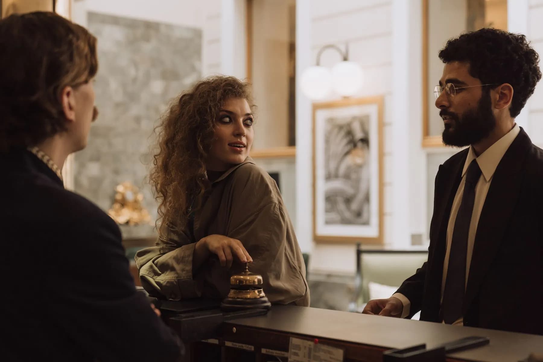 International guests checking in at a hotel reception desk