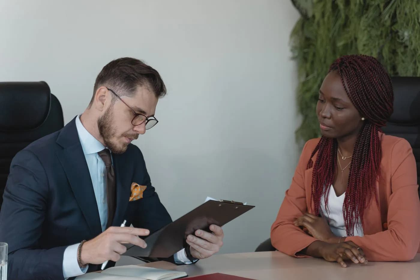 A hiring manager interviewing a candidate in an office
