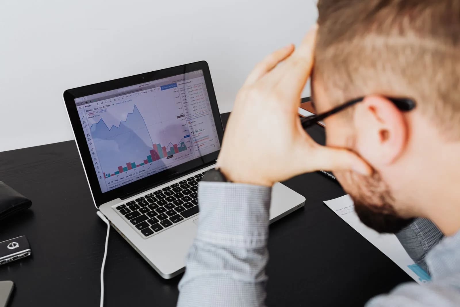 A business owner reviewing campaign results on a laptop