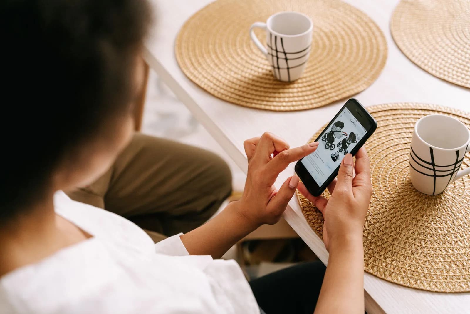 A woman browsing a shop on her phone