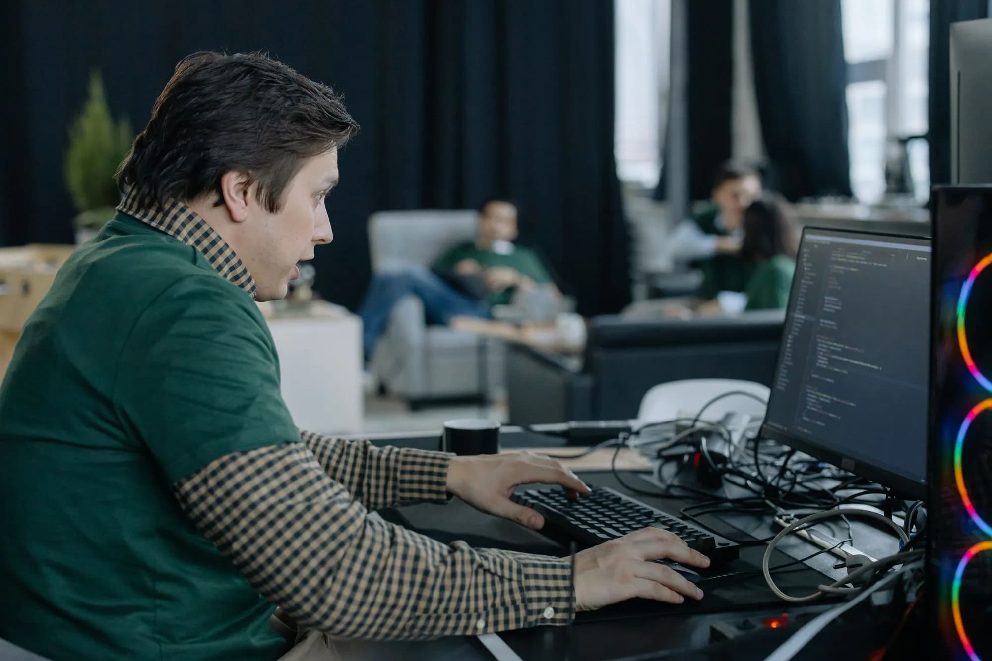 A programmer concentrating on code at his computer