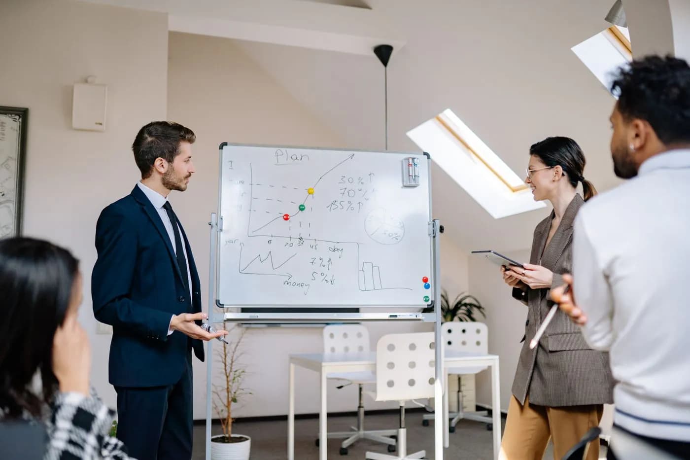 Colleagues planning changes together around a meeting table