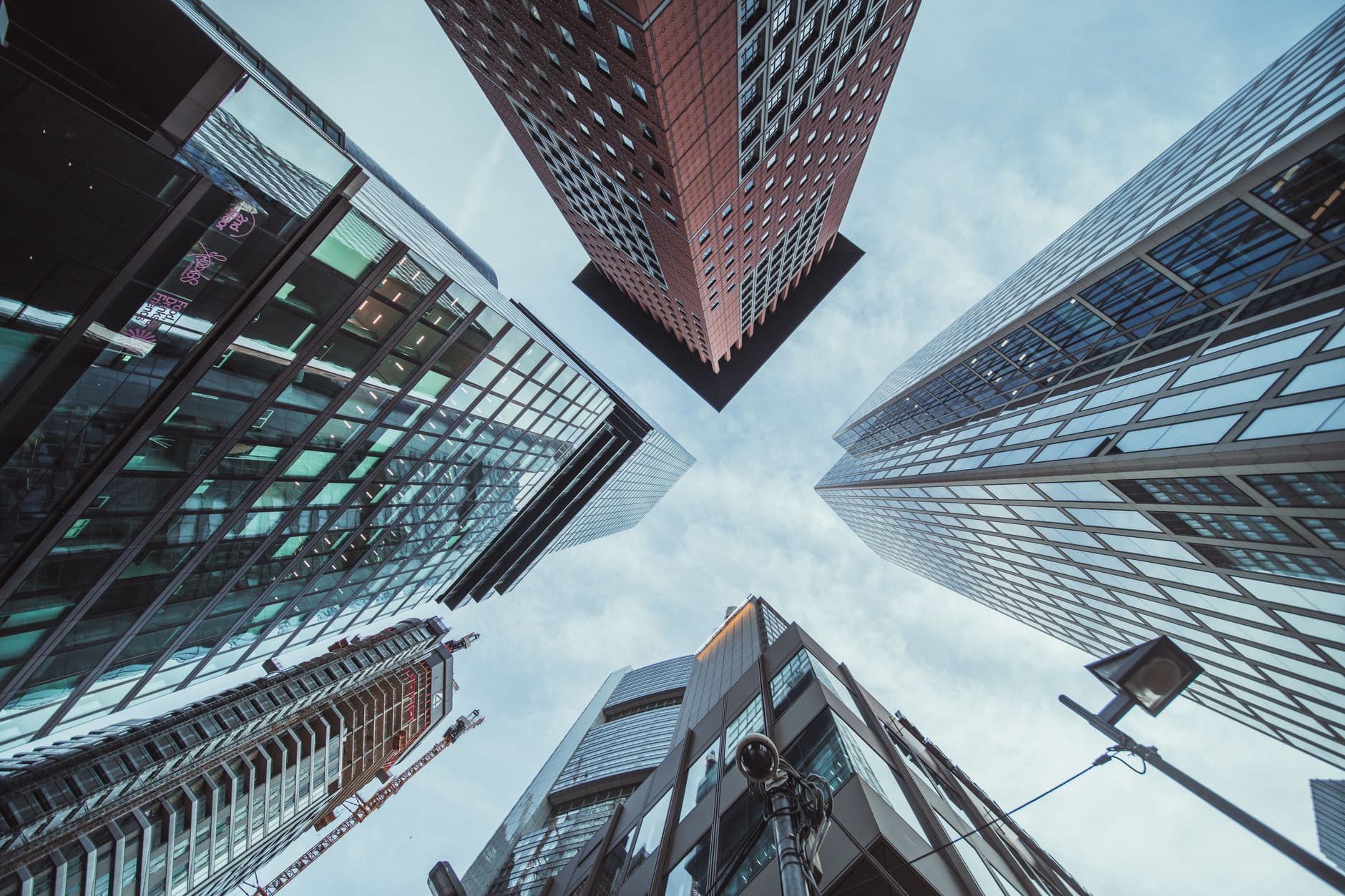 Skyscrapers seen from below against a clear sky.